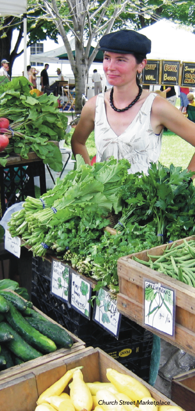 Woman selling vegetables at a farmers market