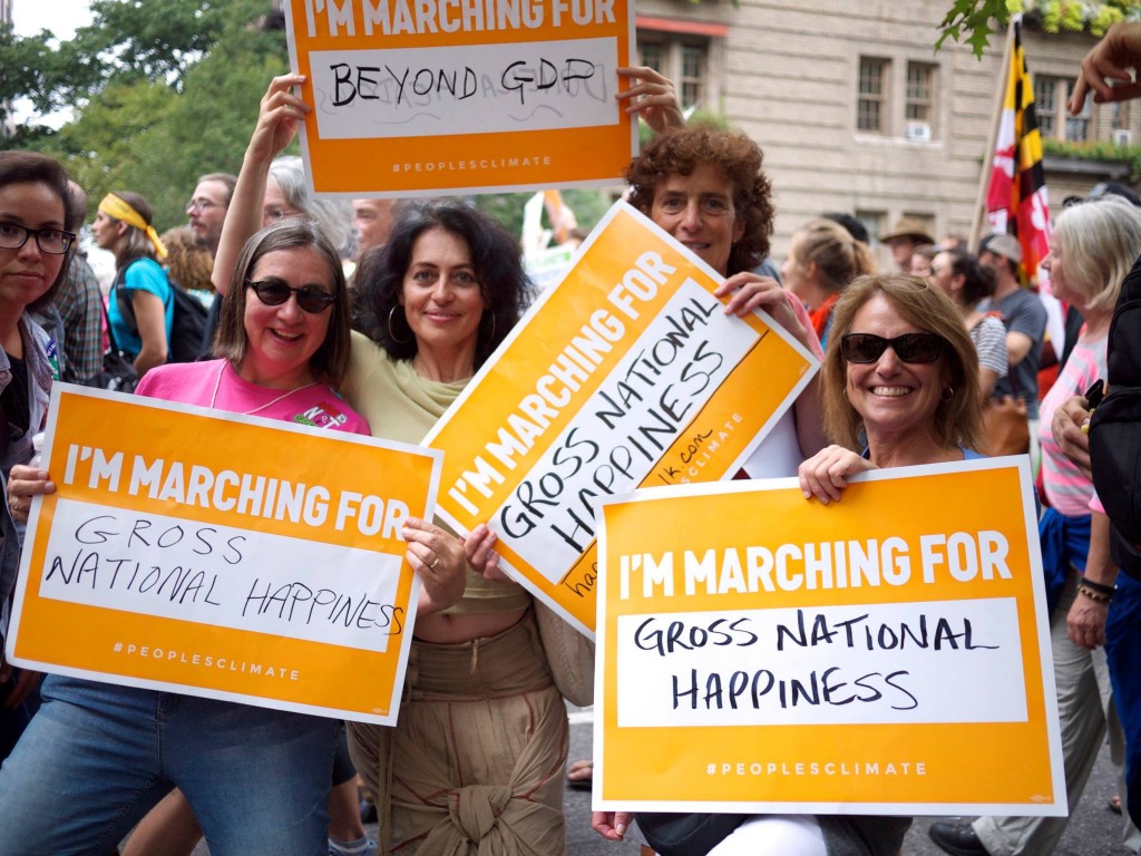 Meadows Institute Marta Ceroni with colleagues from Gross National Happiness USA at the climate march in NYC